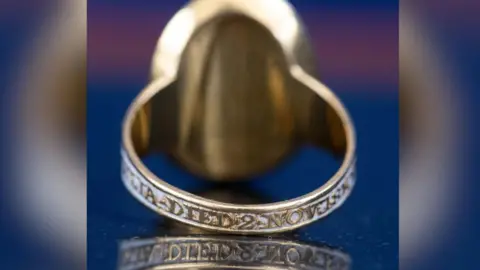 The ring with a blue background