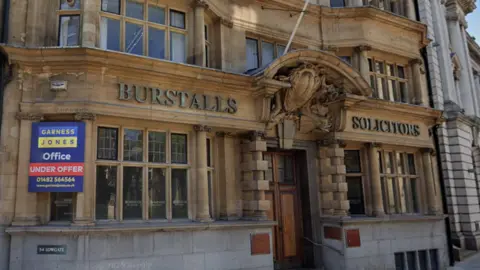 The Grade II listed building on Lowgate in Hull. It is an historic looking building with Burstalls Solicitors in lettering on the front.