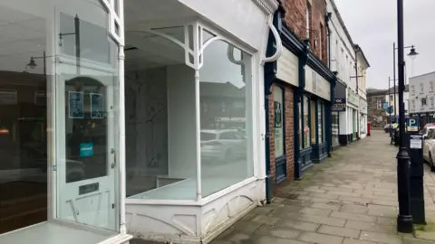 Elizabeth Baines / BBC An empty shop front in Pontefract
