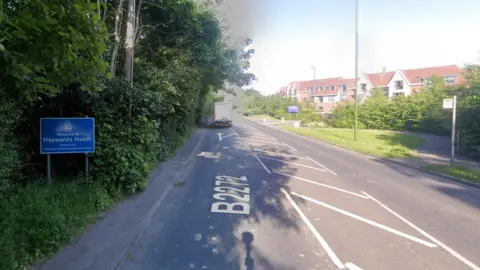 A Google street map image of the road heading into Haywards Heath. The blue sign for the town is on the left