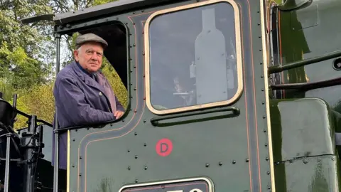 Harry Bradley John Giles in a locomotive