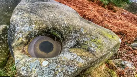 Leigh Pugh A frozen puddle that looks like a giant fish eye 