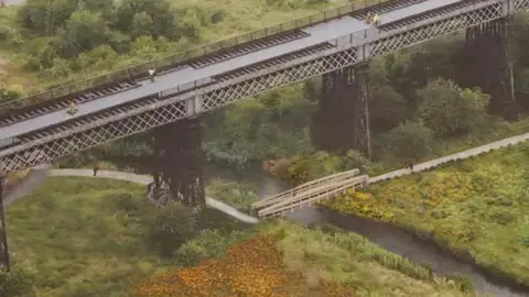 An artist's impression shows a bridge by the historical viaduct 