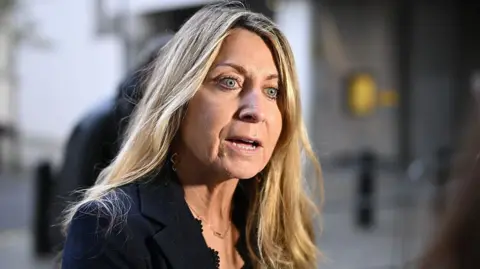 Getty Images Deborah Turness outside the BBC building in a black suit