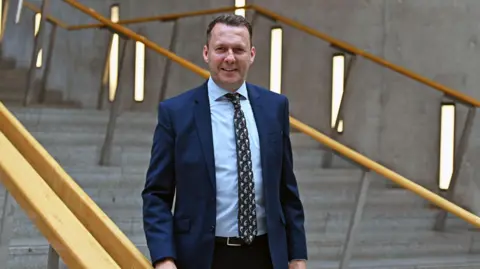 Getty Images Scottish Conservative leadership contender Russell Findlay in the lobby at Holyrood