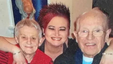 Family Photo Janet Saxon, on the left, with her late husband Leslie Saxon on the right and their daughter Tina Cox between them