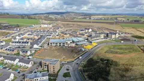 Shepherd Chartered Surveyors/FRP Advisory An aerial view of the Countesswells development under construction, with its primary school in the centre of shot.