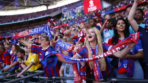 EPA Supporters of Crystal Palace celebrate winning the FA Cup Final in Wembley Stadium.