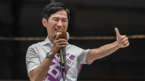 Getty Images Tokyo gubernatorial election candidate and former mayor of Akitakata city of Hiroshima prefecture Shinji Ishimaru delivers a speech during an election campaign in Tokyo 