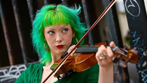 Girl with green hair playing violin