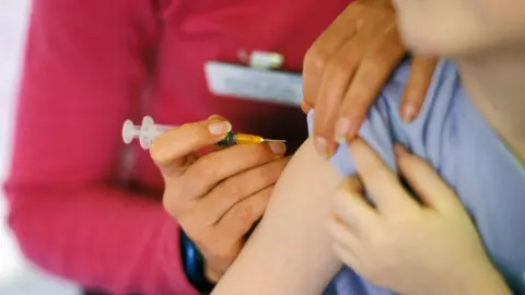 Child getting a vaccine