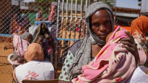 a woman and baby at the Zamzam displacement camp, close to El Fasher in North Darfur, Sudan