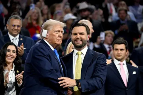 Donald Trump and JD Vance shake hands at the RNC