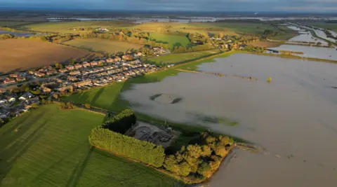 Aeriel view of the flooding of the River Witham in Fiskerton. About half of the fields in the picture are under water. The village can be seen to the left of the picture. 