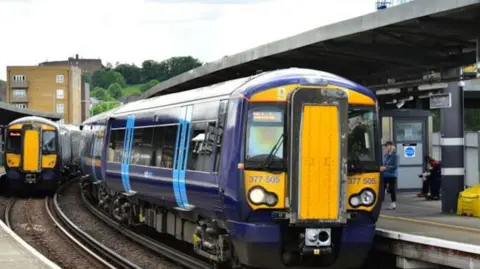 A Southeastern train at a station platform.