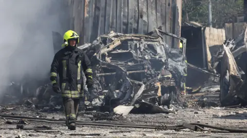 EPA Fireman at scene of rocket attack on a transport depot in Odesa, Ukraine