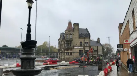 Local Democracy Reporting Service Central Nelson sealed off by white and red barriers with metal fencing