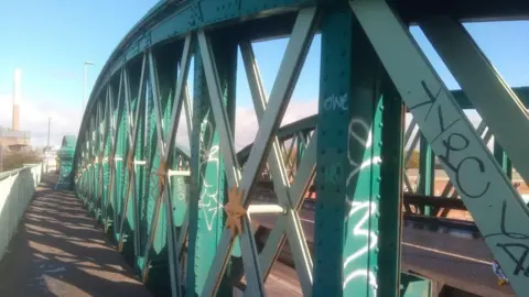 Nottingham City Council Lady Bay Bridge crossing the River Trent, seen from the pedestrian walkway