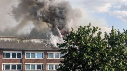 Fire and smoke seen coming from a block of flats