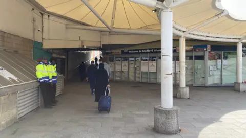 Security guards outside the Bradford Interchange