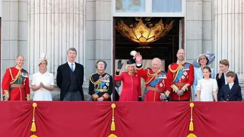 Getty Images Members of the Royal Family stand on the Buckingham Palace balcony. From left to right: The Duke and Duchess of Edinburgh, Vice Admiral Sir Timothy Laurence and the Princess Royal, Queen Camilla and the King, the Prince and Princess of Wales, and Princess Charlotte, Prince George and Prince Louis