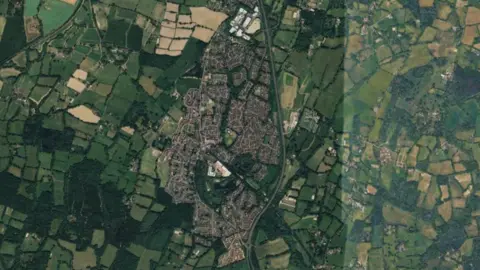 A satellite image of a rural village. 