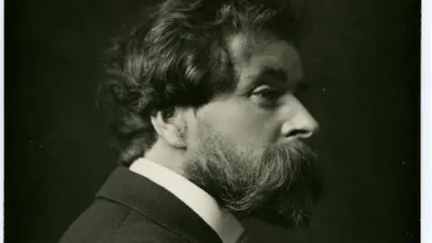 MMH A black and white portrait of Knox, who has wavy hair and a prominent beard and moustache. 