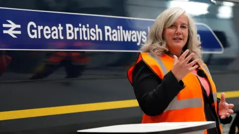 Transport Secretary Heidi Alexander makes a speech in front of a train carriage with Great British Railways branding, during a visit to the South Western Railway (SWR) Bournemouth Traincare Depot, in Dorset, ahead of the rail operator being the first to be renationalised under the Labour government's Passenger Railway Services (Public Ownership) Act 2024.