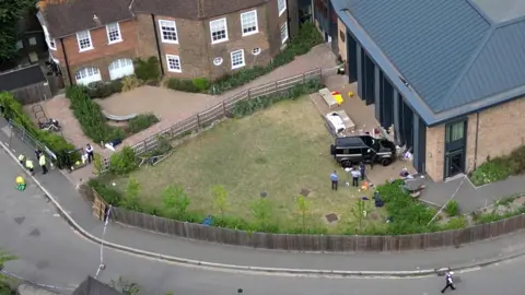PA Media An aerial shot of a Land Rover Defender inside the grounds of The Study Preparatory School in Camp Road, Wimbledon, south London.