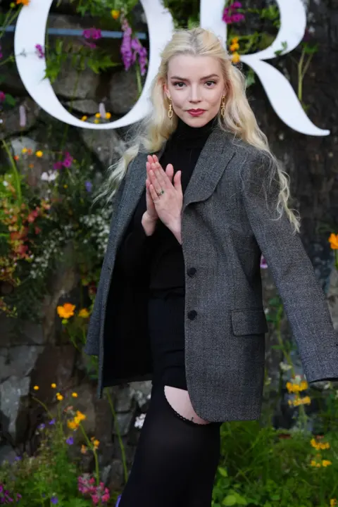 PA Anya Taylor-Joy attends the Dior Cruise 2025 show at Drummond Castle
