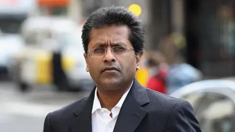 Getty Images LONDON, ENGLAND - MARCH 05: Lalit Modi, a former Commissioner of Indian Premier League cricket, arrives at the High Court on March 5, 2012 in London, England. Ex-New Zealand cricketer Chris Cairns is suing Mr Modi for libel after a tweet by Mr Modi in January 2010 alleged that Mr Cairns was involved in match fixing. (Photo by Oli Scarff/Getty Images)