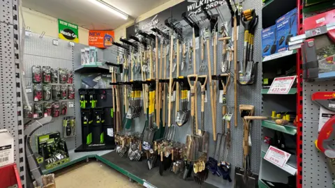 Zoie O'Brien/BBC The inside of a hardware shop showing a wall of tools. 