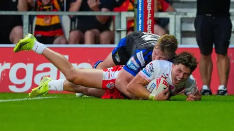 Owen Dagnall scores a try for St Helens against Leeds Rhinos