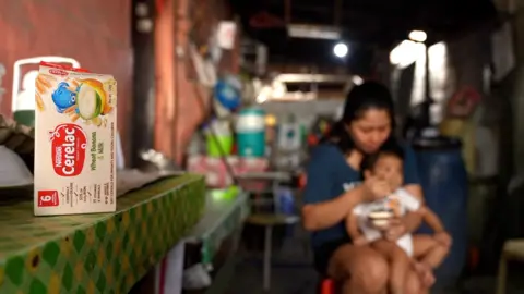 Cerelac box with mother feeding son the infant cereal