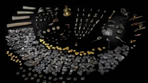 Amgueddfa Cymru A picture of the artefacts line out, including gold and silver coins
