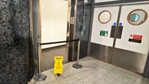 Eddie Mitchell A men's toilet at Gatwick Airport sealed off to the public.