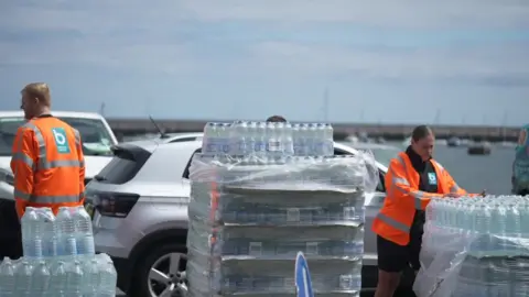 Water bottles being distributed