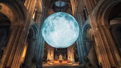 James Billings A large moon sculpture hangs from the ceiling of Peel Cathedral as part of Jerram's exhibtion last year.