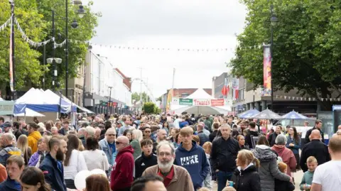 BoltonFoodandDrinkFestival A crowd moving between stalls at the Bolton Food and Drink Festival