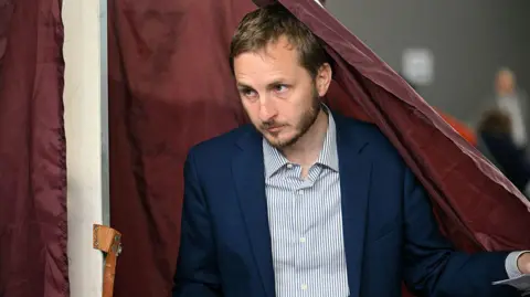 AFP François Piquemal votes in Toulouse