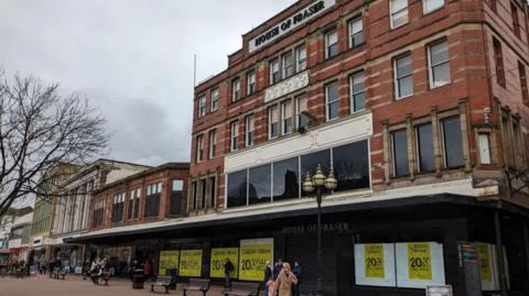 The department store House of Fraser with closing signs in its windows, before it was shut down in May