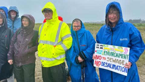 Protesters in wet weather gear