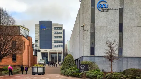 Getty Images A university with grey buildings and GCU written on the side of some of them