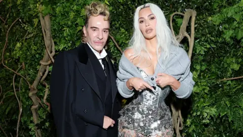 Getty Images John Galliano and Kim Kardashian attend The 2024 Met Gala Celebrating "Sleeping Beauties: Reawakening Fashion" at The Metropolitan Museum of Art on May 06, 2024 in New York City.