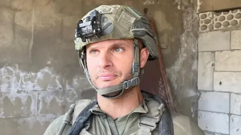 Col Yaniv Malka, who leads the army in Lebanon, speaks to the camera in a combat zone in the country. 