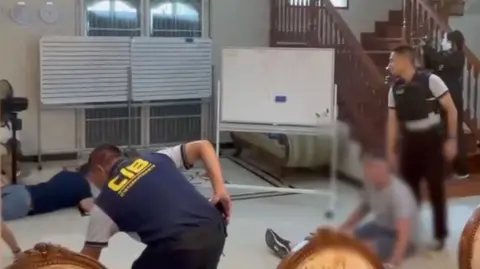 suspects with faces blurred and police officers