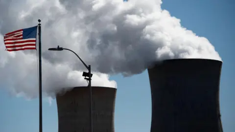 Getty Images Steam rises out of the nuclear plant on Three Mile Island, with the operational plant run by Exelon Generation, in Middletown, Pennsylvania on March 26, 2019. 