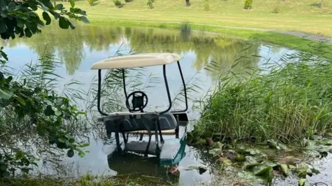 Sussex Police Golf buggy in a pond