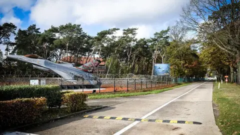 AFP via Getty Images A photo shows a road at the Belgian Air Force Kleine-Brogel air base in Peer, on 2 November 2025.