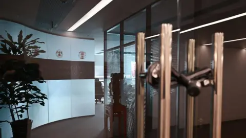 The padlocked door to the office of Mintz Group in Beijing, China